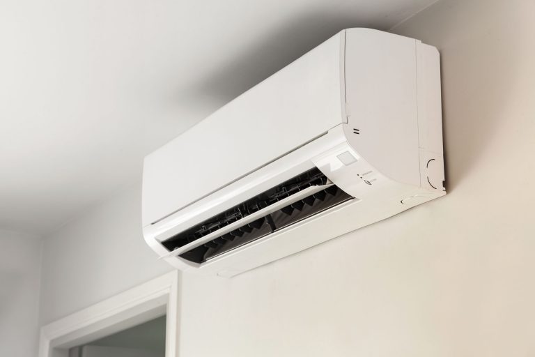 Air conditioner on wall background